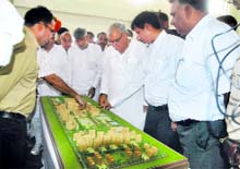 Chief Minister Bhupinder Singh Hooda looks at the model of BPS Medical College for Women at Khanpur Kalan