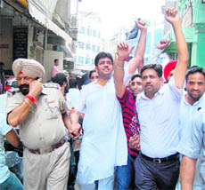 Dinesh Bassi, former president of the District Youth Congress, along with other activists being taken in police custody in Amritsar on Thursday. 
