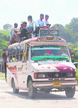 An overloaded minibus at Jagti village near Nagrota on Thursday. 