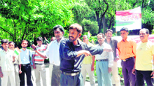 Artistes present a street play on corruption in support of Anna Hazare in Dehradun on Friday.