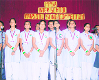 Girl students participate in a patriotic song competition held at Childrens Academy in Dehradun on Friday.