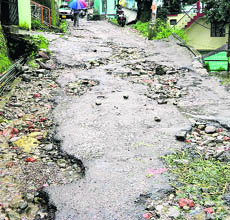 A road damaged by a heavy rain in Dharamkot, Dharamsala