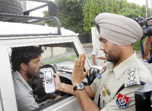 ACP (Traffic) DS Dhillon conducts a trial on a driver by using a breath analyser to check drunken driving in Jalandhar on Friday