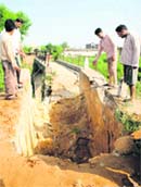 The damaged bridge over a nullah at Bhour Camp in Jammu