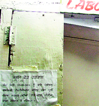 A notice pasted outside the laboratory of the Civil Hospital announces the pen-down strike by the technicians in Ludhiana on Friday