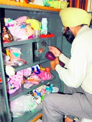 Forensic experts taking fingerprints from where the jewellery and cash was looted in Amritsar