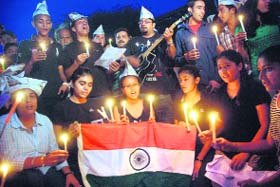 Students take out a candlelight march in support of social activist Anna Hazare in Sector 17, Chandigarh, on Saturday