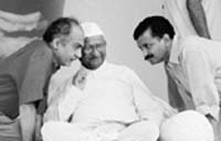 Social activist Anna Hazare with Arvind Kejriwal and Prashant Bhushan (L) at the Ramlila Grounds in New Delhi