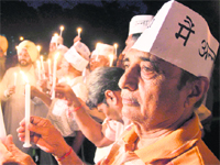 Residents hold a candle-lit vigil in Ludhiana. 