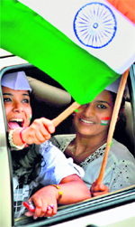 Supporters of Anna Hazare wave a Tricolour during a protest for Jan Lokpal Bill in Bangalore on Saturday
