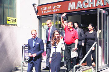 Britains Prince William and his wife Kate, the Duchess of Cambridge, leave after visiting the Machan Express Coffee Bar in Birmingham, which was ransacked during the recent riots in the area