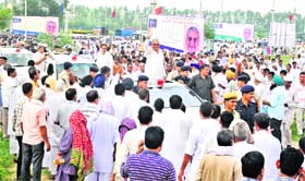 Chief Minister Bhupinder Singh Hooda waves to the crowd at a state-level function in Jind on Sunday