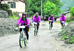 Members of an all-women bicycling expedition on their way from Manali to Leh expedition