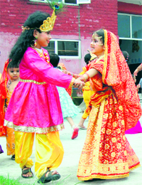 Schoolchildren dressed as Radha and Krishna take part in Janmashtami celebrations at Bachpan School in Dharamsala on Sunday