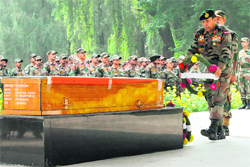 GOC, Chinar Corps, Lt-Gen SA Hasnain lays a wreath to pay homage to Lieutenant Navdeep Singh at BB Cantt in Srinagar on Sunday. 