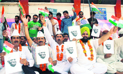 Members of farmer associations stage a protest in support of Anna Hazare in Jammu on Sunday 