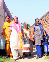 In Ward 1, women carry buckets to fetch water at Dadamal Colony near the Maqsudan bypass in Jalandhar