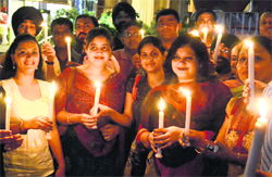 Members of the Indian Dental Association hold a candle-lit vigil in support of Anna Hazare in Jalandhar