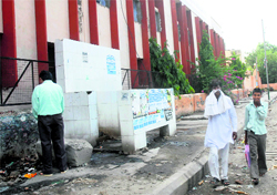 A public urinal and a garbage dump adjacent to the wall of Fentonganj Girls Senior Secondary School in Jalandhar