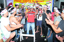 Youngsters sport headbands to express solidarity with Anna Hazares crusade against corruption in Ludhiana on Sunday