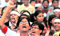 Demonstrators shout slogans at a rally in support of Anna Hazare in Mumbai