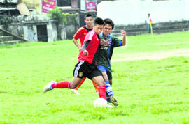 A match in progress in the Lala Nemi Dass Memorial District Football League played at the Pavilion ground in Dehradun on Monday