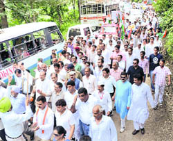 Leaders and activists of the Congress during a padyatra in Solan on Monday.