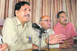 State BJP chief Khimi Ram addresses mediapersons in Shimla on Monday.