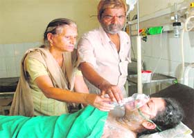 Parents attend to Archana at the Government Civil Hospital in Jalandhar