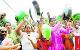 Price war: Members of the Istri Jagriti Manch hold a demonstration against the rise in prices of essential commodities