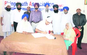 A doctor examines a patient at a medical camp organised by the Rising Youth Association in Ludhiana on Monday