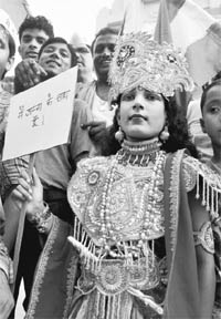 A supporter of Anna Hazare dressed up as Lord Krishna takes part in a protest in support of the Jan Lokpal Bill in Lucknow on Monday