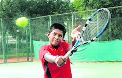A player returns a shot during the AITA talent series in Chandigarh on Tuesday.
