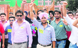 Students of GGDSD College, Sector 32, raise slogans.
