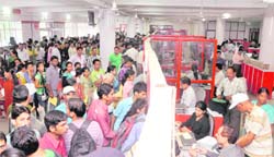 Candidates for nursing courses line up at the Head Post Office in Dehradun to submit their applications