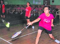 A player in action in the Dehradun District Badminton Championship in Dehradun