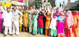 Residents block traffic on Begu road in Sirsa on Tuesday.
