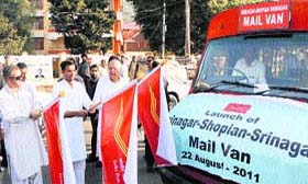 (From left) Chief Minister Omar Abdullah, Minister of State for Communications and IT Sachin Pilot and Union Minister for New and Renewable Energy Farooq Abdullah flag off a Srinagar-Shopian mail delivery van in Srinagar