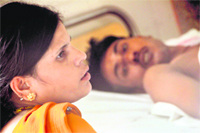 Lali Devi, wife of Guddu, who was injured in a blast at Young Man Woollen Mills, undergoing treatment at DMCH in Ludhiana