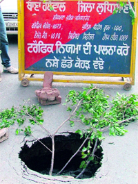 A road cave-in in front of the Civil Surgeons office in Ludhiana