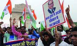 Dalit protestors hold a rally against Annas campaign at the India Gate.