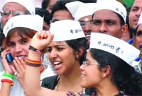 Girls don Anna Caps as they support Annas version of the Jan Lokpal Bill at the Ramlila Ground in New Delhi
