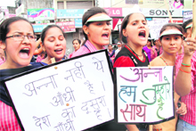 Girls raise slogans in support of Anna Hazare in Dehradun on Wednesday. 