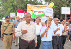 Members of the Indian Medical Association hold a procession in support of Anna Hazare in Dehradun on Wednesday. 