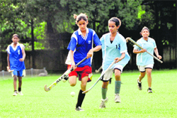 A match in progress in the Major Dhyan Chand Memorial Inter-school Girls Hockey Tournament in Dehradun on Wednesday. 