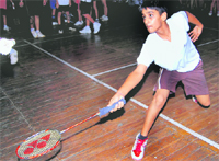 A player in action in the Dehradun District Badminton Championship in Dehradun on Wednesday. 