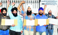 Sikh youths hold a protest in Jammu on Wednesday
