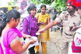 NRHM employees beg to register a protest in support of their demands in Ludhiana