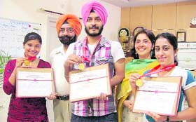 Students of the Guru Nanak Institute of Management and Technology pose with their medals in Ludhiana