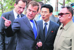 Russias President Dmitry Medvedev points while North Korean leader Kim Jong-il (right) looks on during their meeting at the Sosnovyi Bor military garrison in Siberias Buryatia region on Wednesday.